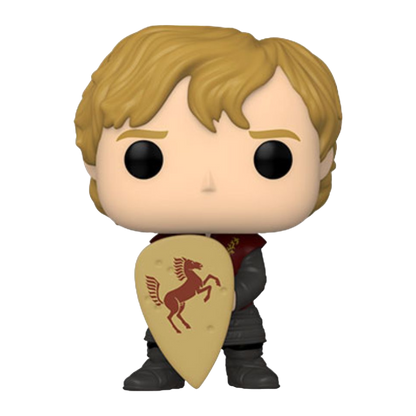 Introducing the A Game of Thrones - Tyrion with Shield Pop! Vinyl, a must-have for collectors, featuring a blond knight in a dark outfit with a tan shield displaying a red horse emblem, capturing Tyrion Lannisters bold spirit.