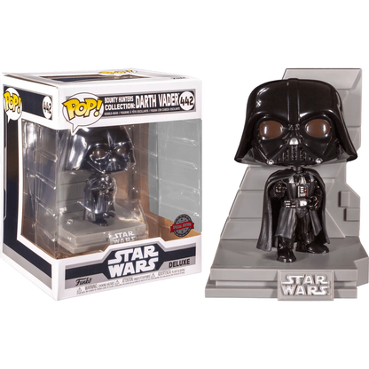 A Funko Pop! figure of Darth Vader from the Star Wars Bounty Hunter Collection, number 442, stands beside its matching box. This US Exclusive Pop! Deluxe Diorama features him in a cape and helmet on a Star Wars branded base, with box art complementing his design.