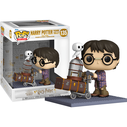 The 20th Anniversary Pop! Vinyl Deluxe features Harry Potter pushing a trolley with luggage and an owl, including a detailed collectible figure and display box marked Harry Pushing Trolley #135.